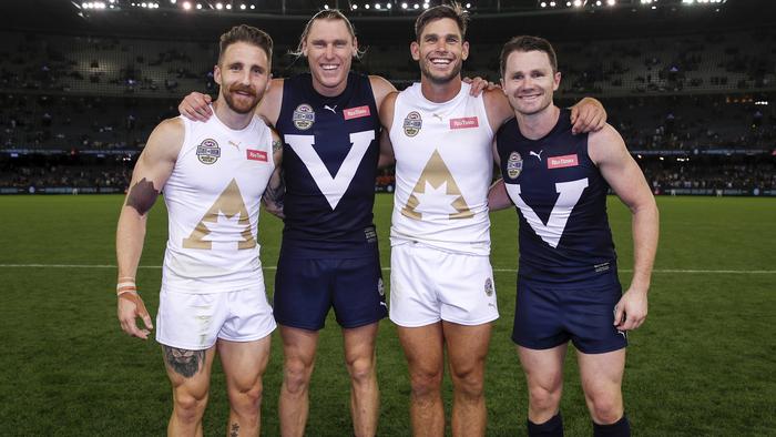 MELBOURNE, AUSTRALIA - FEBRUARY 28: Zach Tuohy and Tom Hawkins of the All Stars pose for a photo with Mark Blicavs and Patrick Dangerfield of Victoria during the 2020 State of Origin for Bushfire Relief match between Victoria and the All Stars at Marvel Stadium on February 28, 2020 in Melbourne, Australia. (Photo by Dylan Burns/AFL Photos via Getty Images)