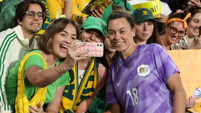 Mackenzie Arnold poses for photos with Matildas fans. Picture: Getty Images