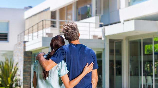 CM New estates magazine - generic young couple looking at new house