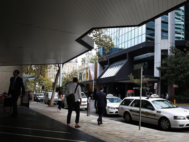 Taxis parked in metered spaces on Berry St.