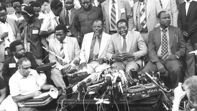 Robert Mugabe (second right) holds his first press conference after winning election for prime minister at his home in Salisbury on March 6, 1980.