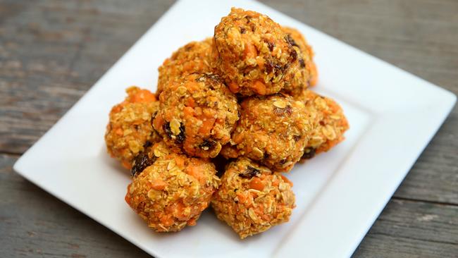 Healthy filler: Almonds add protein and flavour to these carrot and oat bliss balls. Picture: Andy Rogers