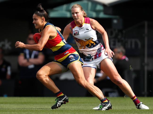 ADELAIDE, AUSTRALIA - APRIL 17: Stevie-Lee Thompson of the Crows and Kate Lutkins of the Lions in action during the 2021 AFLW Grand Final match between the Adelaide Crows and the Brisbane Lions at Adelaide Oval on April 17, 2021 in Adelaide, Australia. (Photo by Michael Willson/AFL Photos via Getty Images)