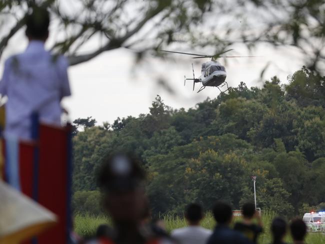 A helicopter carrying one of the rescued boys lands at the hospital after evacuating the boys, who have spent two weeks trapped in Tham Luang cave. Picture: AP Photo/Vincent Thian