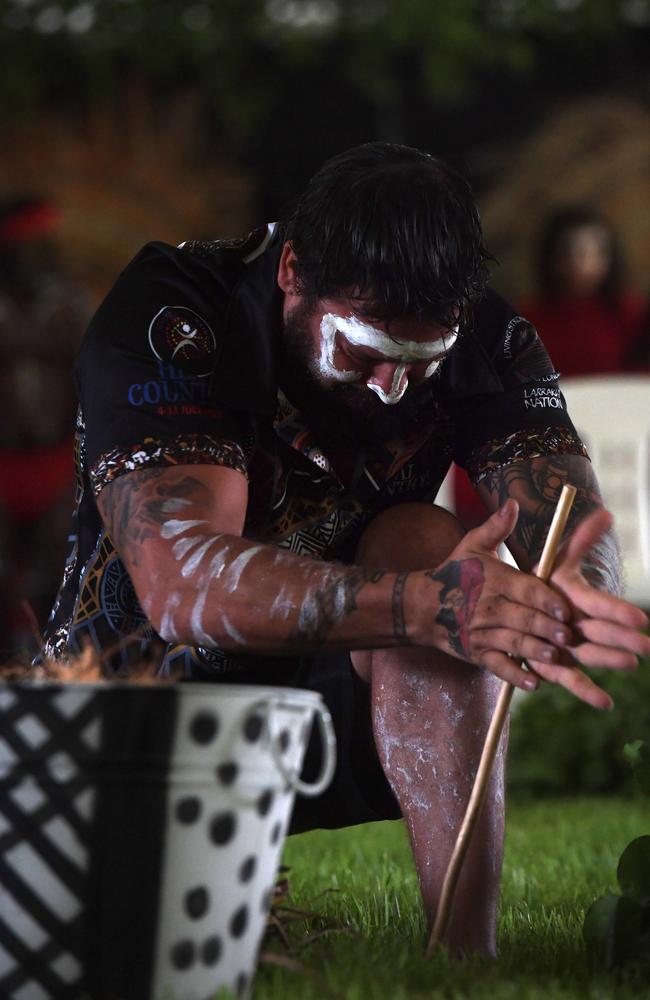 Trent Lee starts the fire for the smoking ceremony at Darwin Waterfront celebrations. Picture: (A)manda Parkinson