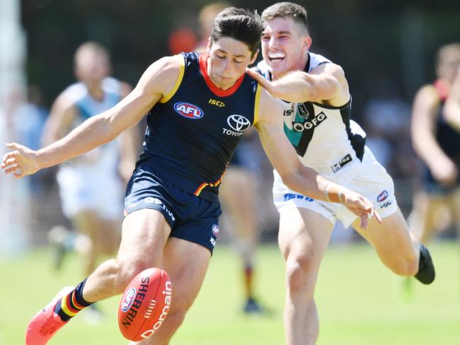 Chayce Jones of the Crows and  Joe Atley of the Power during an AFL pre-season hit out match between the Adelaide Crows and the Port Adelaide Power at Thebarton Oval in Adelaide, Saturday, February 29, 2020. (AAP Image/David Mariuz) NO ARCHIVING, EDITORIAL USE ONLY