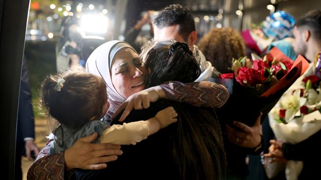 Mona pictured with family and friends as she arrives at Sydney Airport after travelling from Gaza. Picture: Damian Shaw