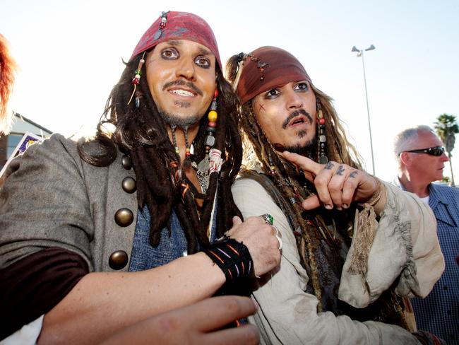 Impersonator George Prince gets a picture with Johnny Depp at Raby Bay. Picture: Mark Calleja