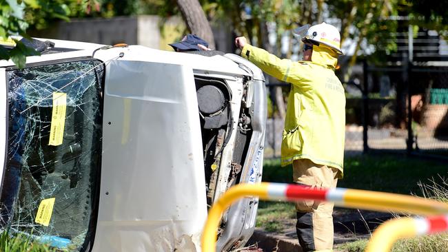 Emergency Services respond to a Holden ute that rolled on its side after an alleged road rage incident on Nathan St, Heatley. Picture: Alix Sweeney