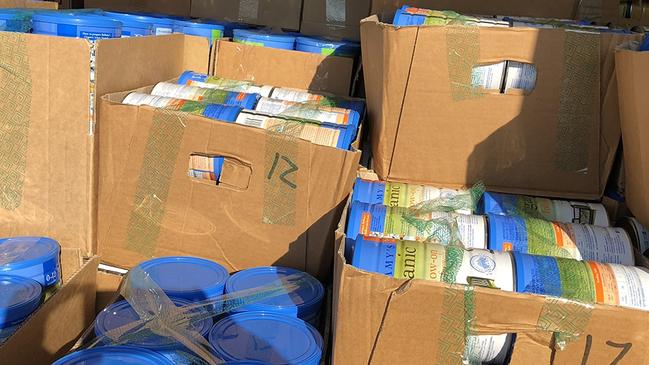 PARRAMATTA ADVERTISER: Police seize thousands of baby formula tins in a burglary sting in Carlingford. Wednesday 22 August 2018. 