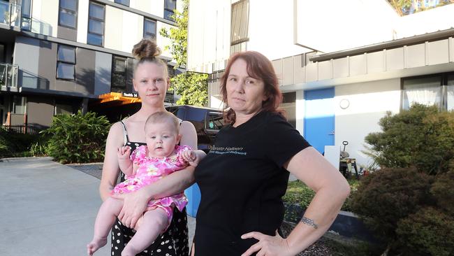 Olivia Shepherd-Richards with 6 month old Nova Burrows and Renate Halleen in front of their rental property. Picture: Richard Gosling