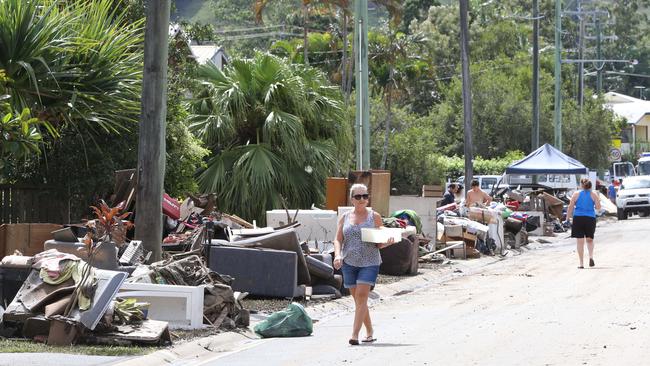 Locals are flat-strapped cleaning up after the floods but disaster tourists are hampering clean up efforts in Tumbulgum. Picture Glenn Hampson