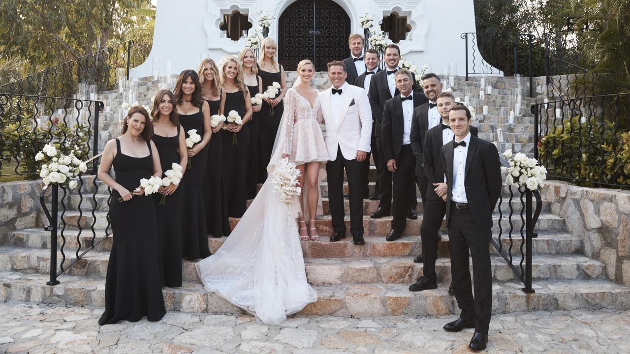 Karl and Jasmine with their bridal party. Bridesmaids: her high school friends Sarah Johnson, Sophie Pentland, Jimilla Houghton, Stoj Bulic, and Georgie Fleming, sister Jade Yarbrough and business partner Tamie Ingham. Groomsmen: Brothers Tom and Pete Stefanovic, Josh Yarbrough, close friends Ben Tilley, Mick Doohan, Steve Marshall and schoolfriend Alan Rogina.