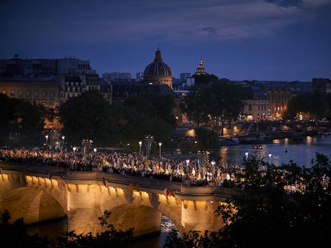 Models parade down Pont Neuf Bridge during the Louis Vuitton Menswear Spring/Summer 2024 show as part of Paris Fashion Week on June 20, 2023 in Paris, France. Picture: Kiran Ridley/Getty Images