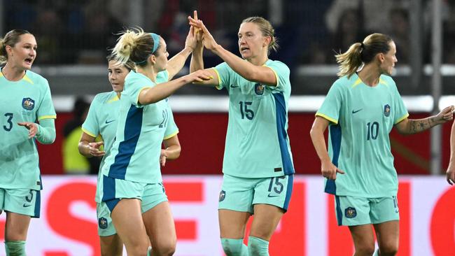 Clare Hunt celebrates scoring against Germany. Picture: Ina Fassbender / AFP