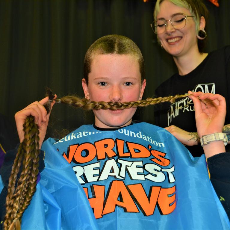 At the St Joseph's College 2023 World's Greatest Shave event is Meghan Ellis getting her cut by hairdresser Caitlin Symes from the Hair Room on Russell. Picture: Rhylea Millar