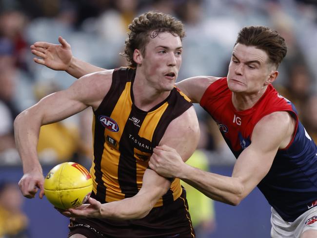 MELBOURNE, AUSTRALIA - MAY 13: Bayley Fritsch of the Demons tackles Josh Weddle of the Hawks during the round nine AFL match between Hawthorn Hawks and Melbourne Demons at Melbourne Cricket Ground, on May 13, 2023, in Melbourne, Australia. (Photo by Darrian Traynor/AFL Photos/via Getty Images )