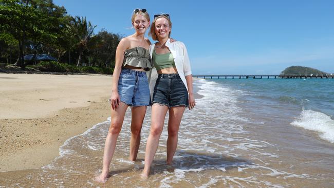 Palm Cove resident Demi Morris (left) enjoys a day out at the beach with her friend Emily Govier, who is visiting from Adelaide. Picture: Brendan Radke