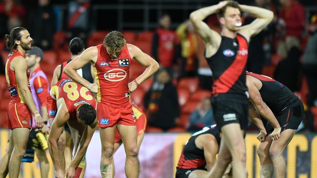 Bombers miss out on four points as Essendon and Gold Coast players come to terms with a drawn result at the final siren.