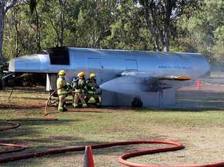 Rural Fire Service crews show off their skills in a simulated plane crash where the engine caught fire. Picture: Shayla Bulloch