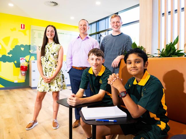 Golden Grove High School 2022 graduate Alana Wilkinson, 17, principal Peter Kuss, graduate Sam Bate, 18, (back) with current year 7 students Zac Kenny, 12 and Vivaan Pande, 12, (front) at the school on January 27, 2023. Picture: Morgan Sette