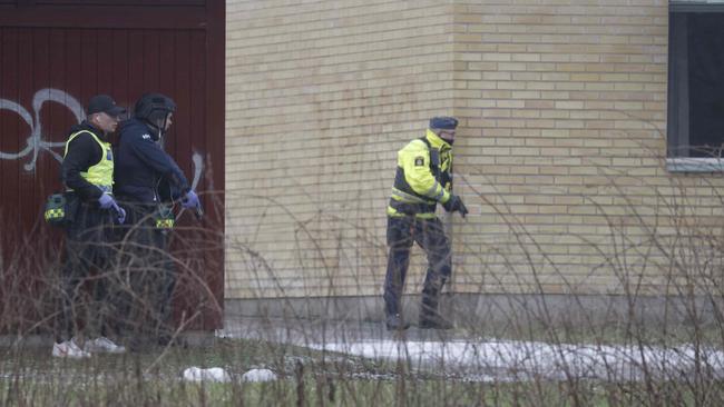 Police officers are seen at the Risbergska School in Orebro, Sweden, on February 4, 2025, following reports of a serious violent crime. (Photo by Kicki NILSSON / TT NEWS AGENCY / AFP)