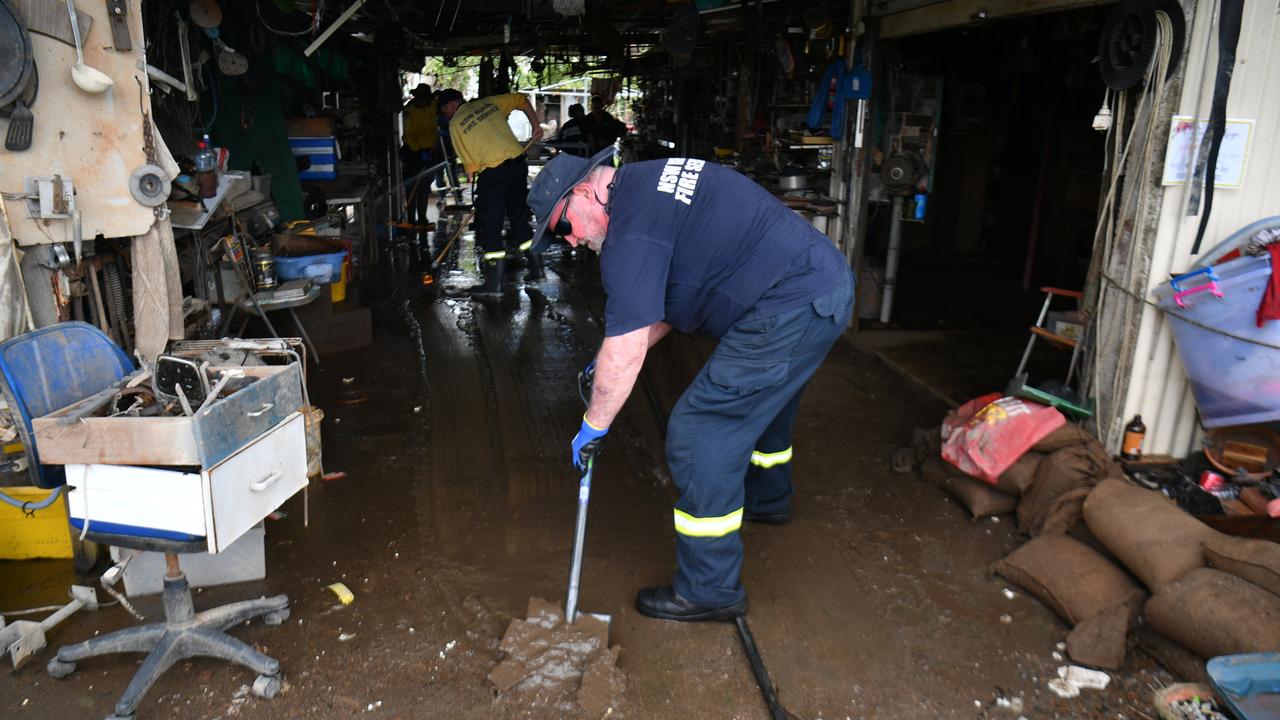 Wednesday February 13. Heavy rain causes flooding in North Queensland. Clean up after flooding in Ingham. Rural firefighters from southern Queensland and NSW help clean up Pastor Joe Marolla's home in Skinner Street. Picture: Evan Morgan