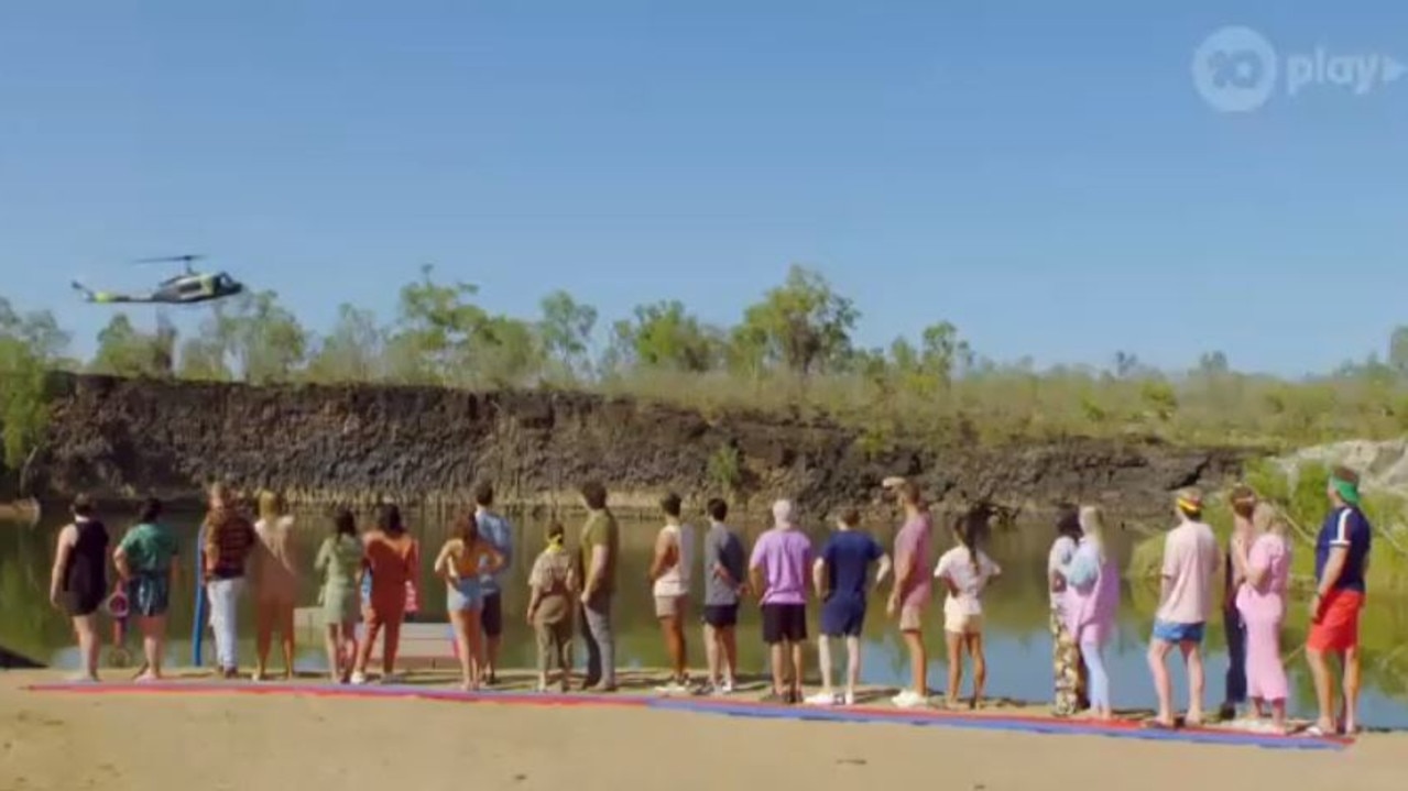 Subtle … the other contestants watch as Sandra and Nina arrive via chopper.