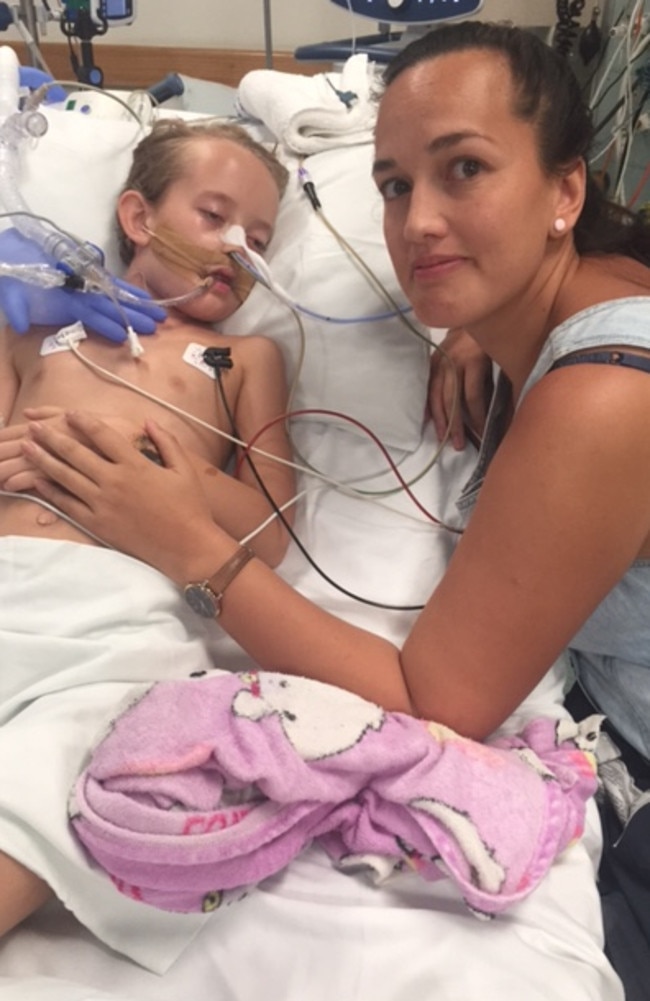 Eight-year-old Sienna Santiago in intensive care at the Royal Darwin Hospital in 2019. Her family believe her medical episode was caused by exposure to mould within their family home provided to them by NT Police. Picture: Supplied.