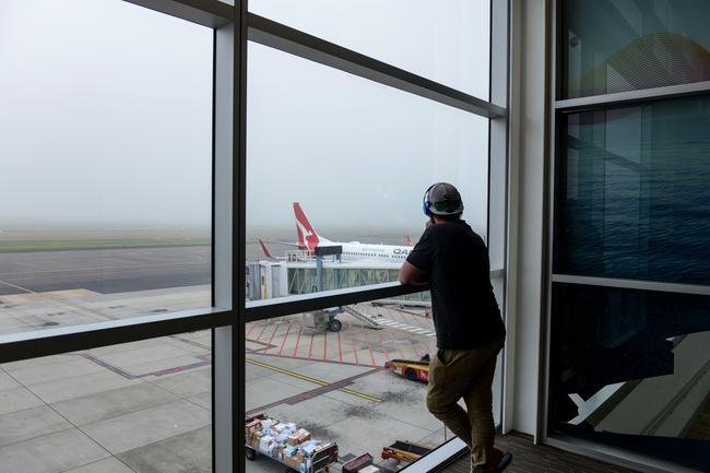 The long, long wait for the fog to lift at Adelaide Airport. Picture: AAP / Brenton Edwards