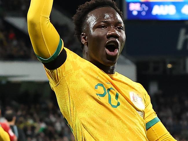 PERTH, AUSTRALIA - JUNE 11: Nestory Irankunda of Australia celebrates a goal from a penalty kick during the Second Round FIFA World Cup 2026 Qualifier match between Australia Socceroos and Palestine at HBF Park on June 11, 2024 in Perth, Australia. (Photo by Paul Kane/Getty Images)