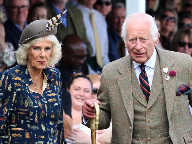 BRAEMAR, SCOTLAND - SEPTEMBER 08: King Charles III and Queen Camilla laugh as they sit in the Royal box and attend The Braemar Gathering 2024 at The Princess Royal and Duke of Fife Memorial Park on September 08, 2024 in Braemar, Scotland. The Braemar Gathering, renowned globally, is the most famous of the Highland Games. Every year, on the first Saturday in September, this vibrant Scottish tradition draws thousands of visitors to the small village of Braemar. With a history spanning nearly two centuries in its modern form, the Gathering stands as one of Scotland's most celebrated events. (Photo by Chris Jackson/Getty Images)