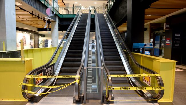 A usually bustling Melbourne Central is now empty as stage 4 restrictions hit the retail sector. Picture: Andrew Henshaw