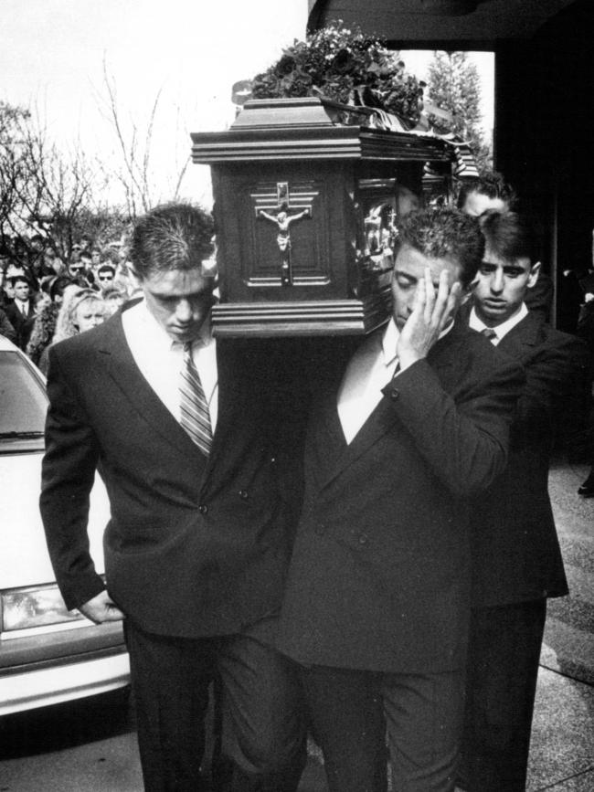 Greg carrying his brother’s casket at his funeral.