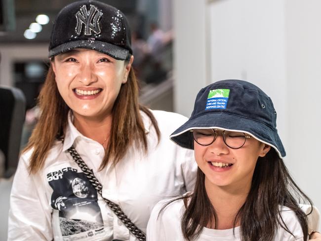 Teena Tao photographed with her daughter Felicity He arriving at Sydney airport after being held in quarantine in Darwin. Picture: Monique Harmer