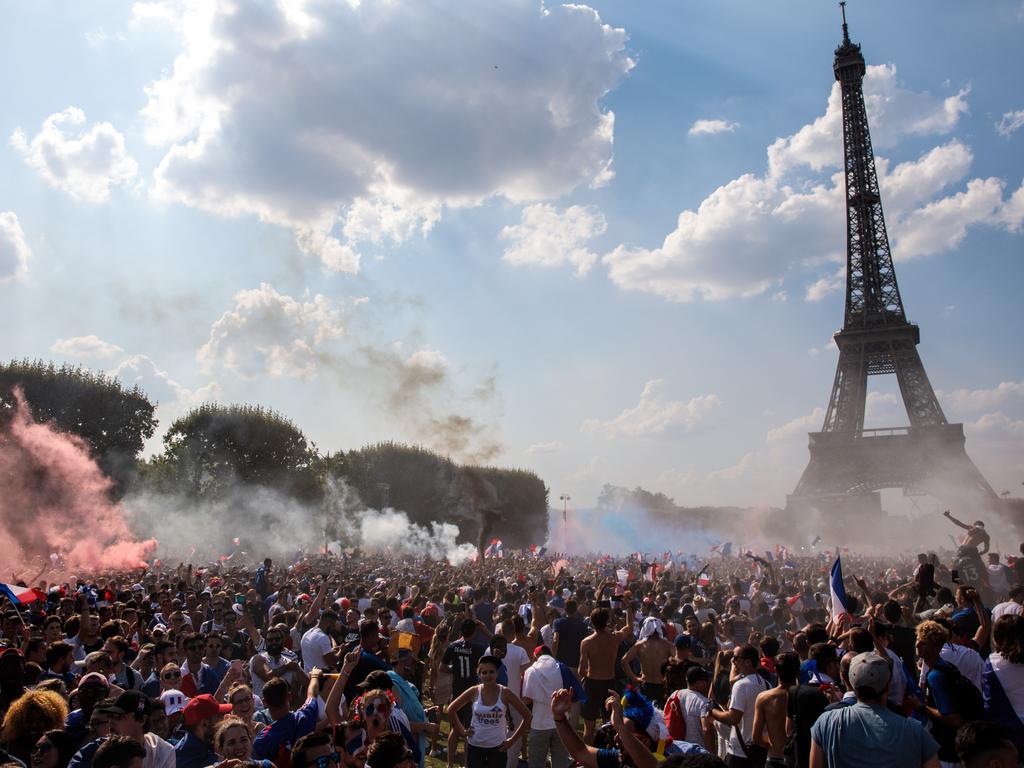 French football fans celebrate in the Champs-de-Mars fan zone as France score their first goal against Croatia in the FIFA 2018 World Cup Final match on July 15, 2018 in Paris, France. The World Cup Final is shown today on giant screens across France as Croatia face France at Moscow's Luzhniki Stadium. (Photo by Jack Taylor/Getty Images) *** BESTPIX ***
