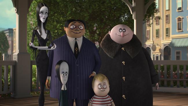 Morticia (Charlize Theron), Wednesday (Chloe Grace Moretz), Gomez (Oscar Isaac), Pugsley (Finn Wolfhard), and Uncle Fester (Nick Kroll) in a scene from the movie The Addams Family. Supplied by Universal Pictures.