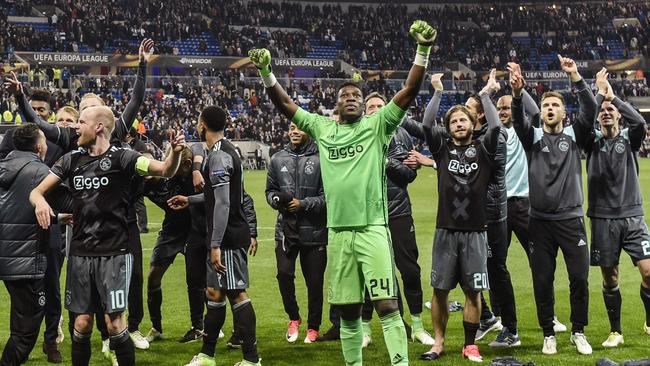 Ajax' players celebrate their victory.