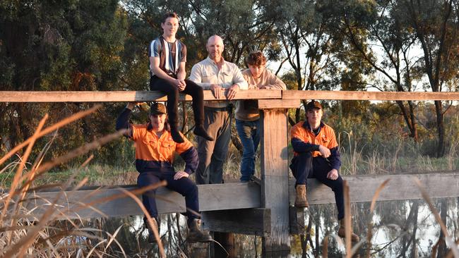 Rice Growers Association president Peter Herrmann, with his sons Oswald, Barney, Kipling and Fred, at their farm in Murrami, NSW. Picture: Noah Yim