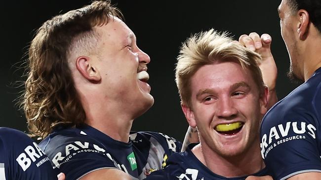 Tom Dearden and Reuben Cotter of the Cowboys celebrates with teammates. Picture: Matt King/Getty Images