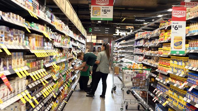 Staff are busy putting the finishing touches on the store today, ahead of its launch. Picture: AAP Image/Richard Gosling