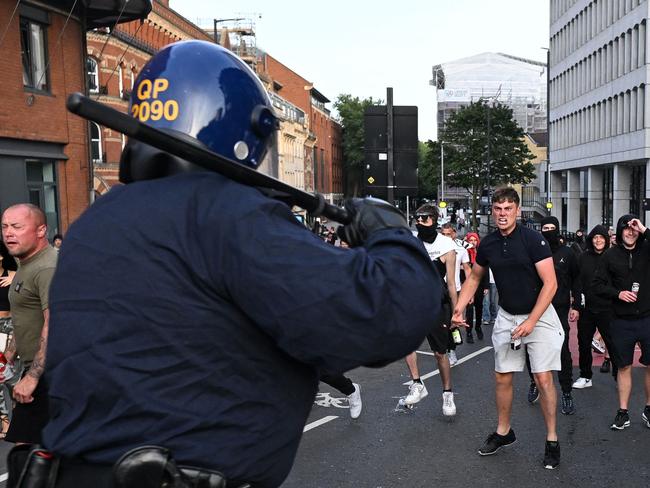 Riot police face protesters in Bristol, southern England, earlier this month. Picture: Justin Tallis/AFP