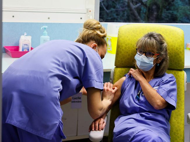 Medical staff at a French hospital receive the AstraZeneca vaccine. Picture: AFP