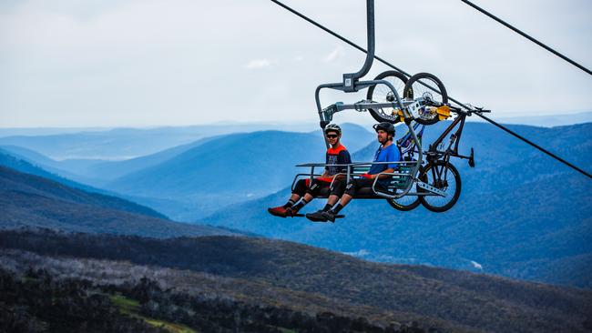 Supplied Editorial Mountain bikers ride the chairlift at Thredbo.