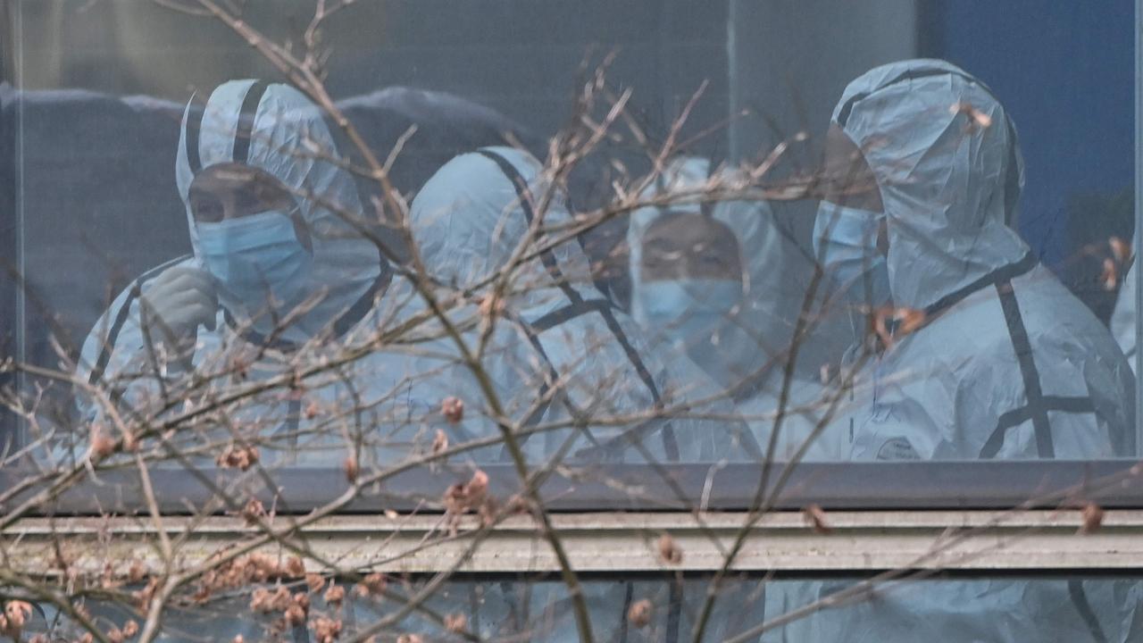 Members of the WHO team during their visit to the Hubei Centre for animal disease control and prevention in Wuhan. Picture: Hector Retamal/AFP