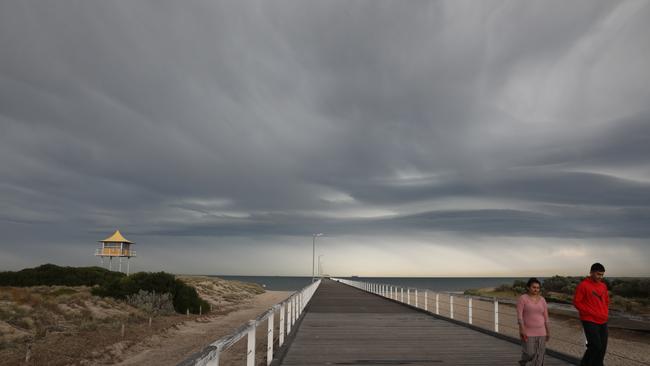 Storm clouds roll in across Semaphore Jetty on Thursday. Picture: Dean Martin