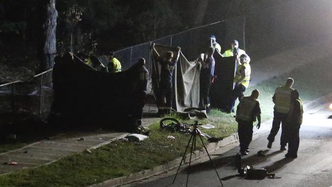 Emergency services holding sheets on Bettington Rd, Oatlands. Picture: Steve Tyson