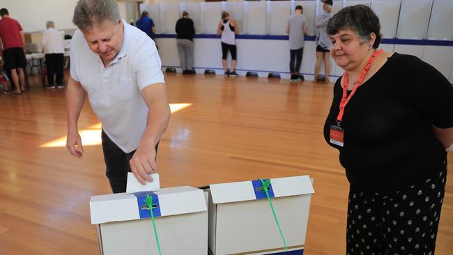 Voters cast their ballots in the Tasmanian State Election at Sorell Memorial Hall, Saturday, March 3, 2018. (AAP Image/Rob Blakers)