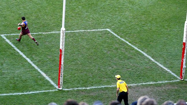 Chris Johnson takes a kick-in during the 2004 Grand Final.