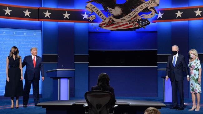 Melania and Donald Trump and Joe and Jill Biden after the first presidential debate. Trump was criticised for his disinclination to wear masks - and complete failure to do anything to arrest the spread of the virus. Picture: Kevin Dietsch/UPI/Bloomberg via Getty Images